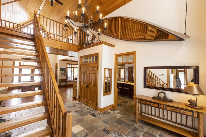 Front hall with the cedar canoe overhead